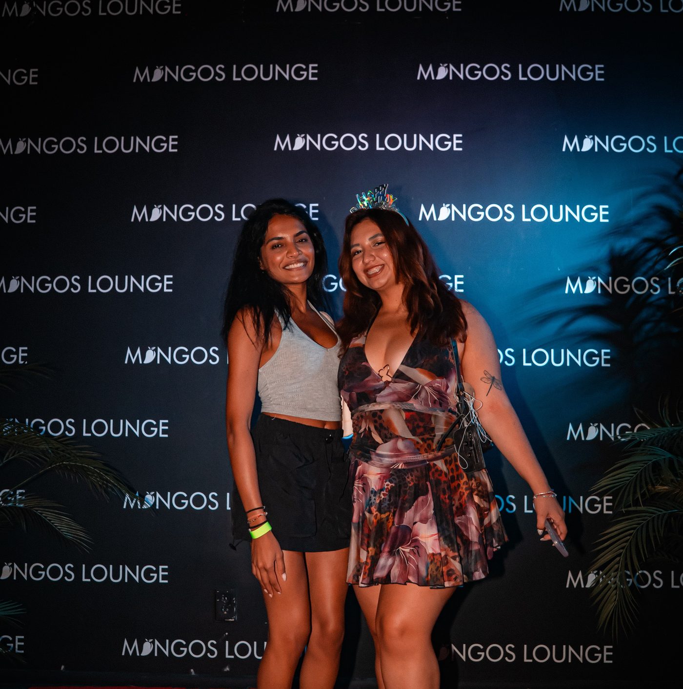 Birthday guests at the Mangos Lounge photo wall