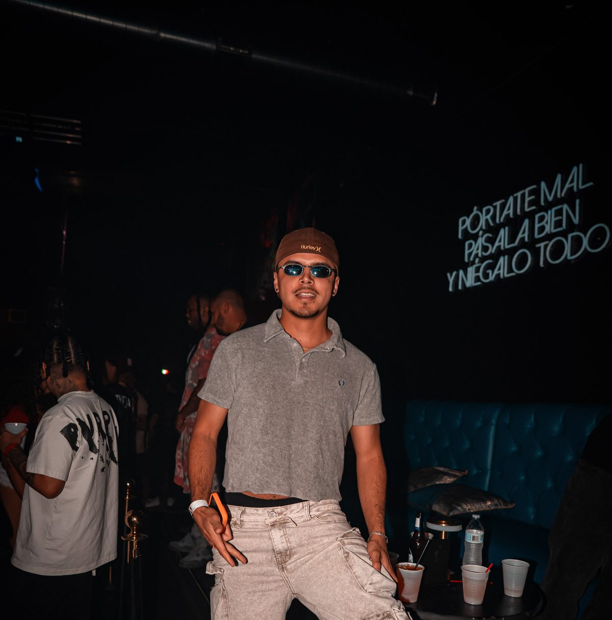 Guest by the neon sign